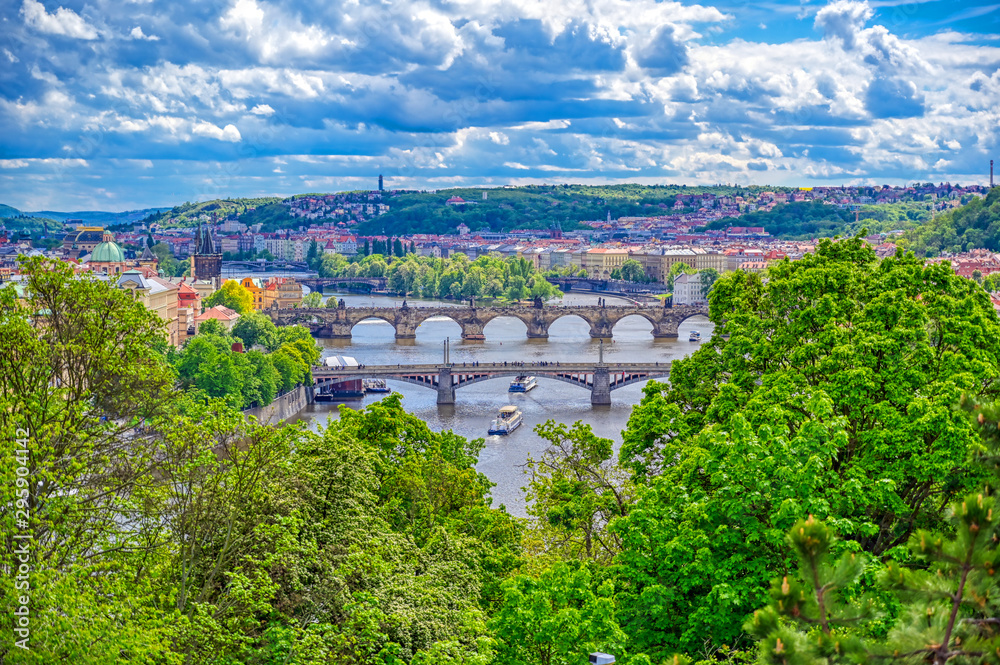 A view of Prague, Czech Republic and the Vltava River from Letna Gardens on a sunny day.