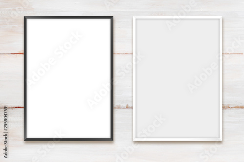 Obraz na płótnie White and black photo frames on a wooden wall w salonie