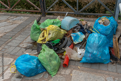 View of some bags full of rubbish and plastics picked up from the nature - image