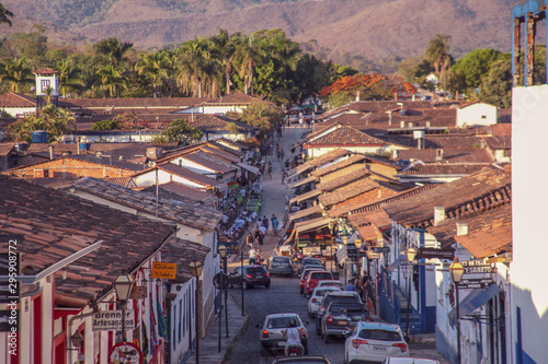 Pirenopolis, Goias, Brazil, October 17, 2019: Slopes and heavily wooded cobblestone streets with many cars in the historic center of Pirenopolis, with bars, restaurants, craft shops and entertainment.