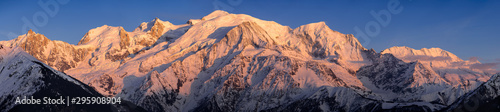 Mont Blanc mountain range at sunset. Aiguille du Midi needle, Mont Blanc du Tacul, Bossons Glacier, Mont Blanc. Chamonix, Haute-Savoie, Alps, France photo