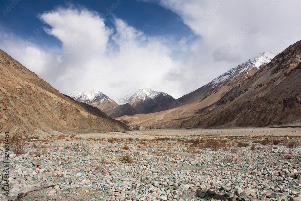 View landscape with Himalayas mountains and between Diskit - Turtok Highway road go to Pangong Tso high grassland lake while winter season at Leh Ladakh in Jammu and Kashmir, India
