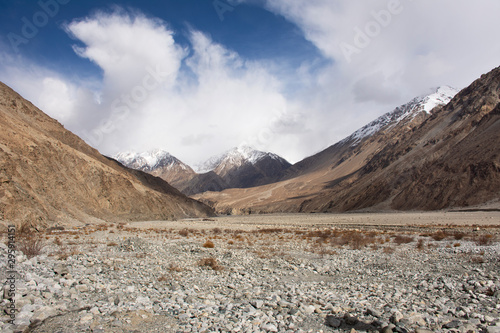 View landscape with Himalayas mountains and between Diskit - Turtok Highway road go to Pangong Tso high grassland lake while winter season at Leh Ladakh in Jammu and Kashmir  India