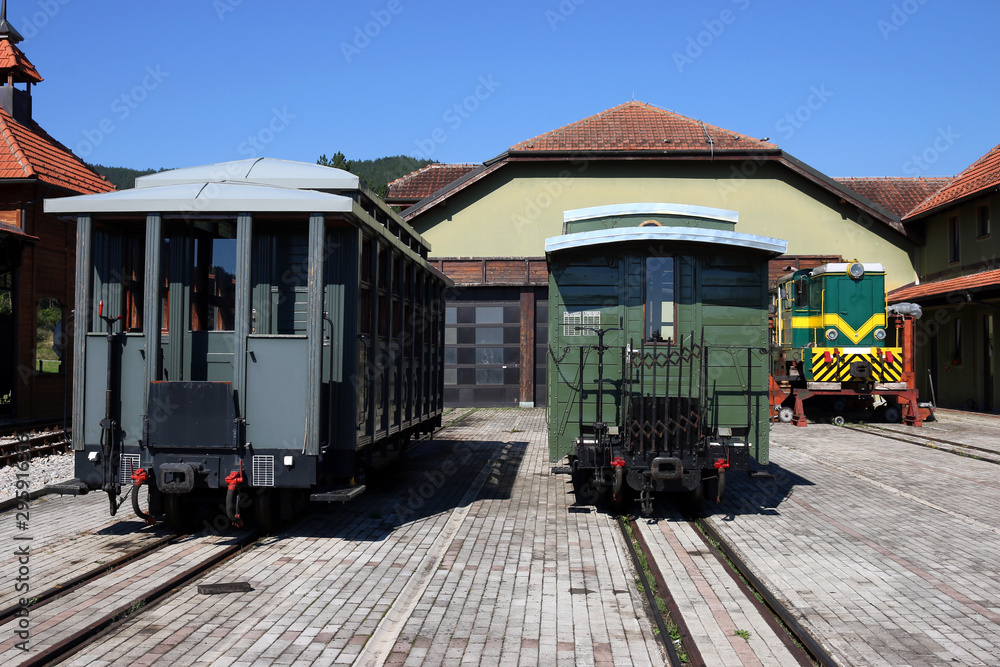 railway station with old locomotive and  wagons