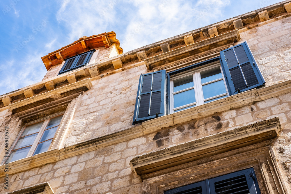 Detail of the traditional stone house and blue summer sky in Dubrovnik city, Dalmatia, Croatia Detail of the traditional stone house and blue summer sky in Dubrovnik city, Dalmatia, Croatia