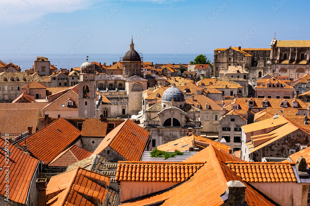 Stone houses with red roofs in old historic Dubrovnik city, Dalmatia, Croatia on sunny summer day, the most popular touristic destination