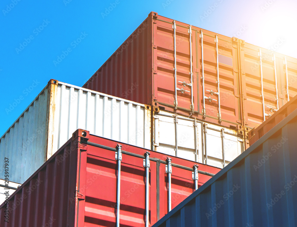 Fototapeta premium Stack of containers box from Cargo freight ship for import-export at harbor and transportation industrial concept.