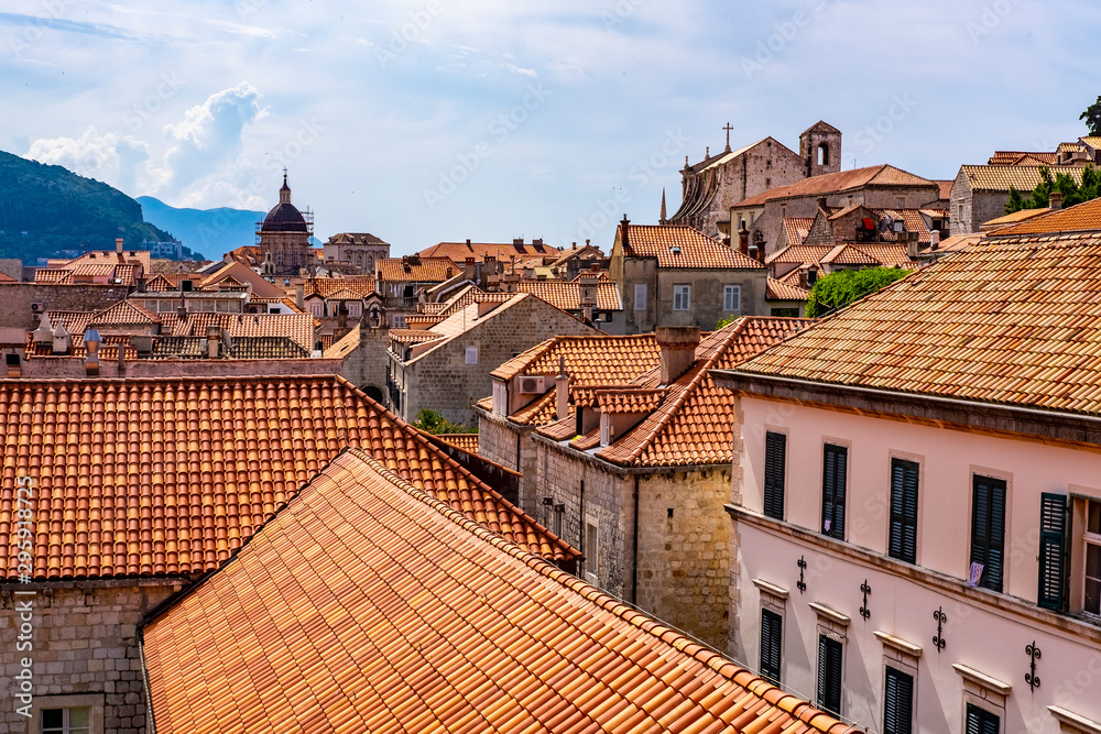 Red roofs in Dubrovnik city stone walls, Dalmatia, Croatia, blue summer day, the most popular touristic travel destination  