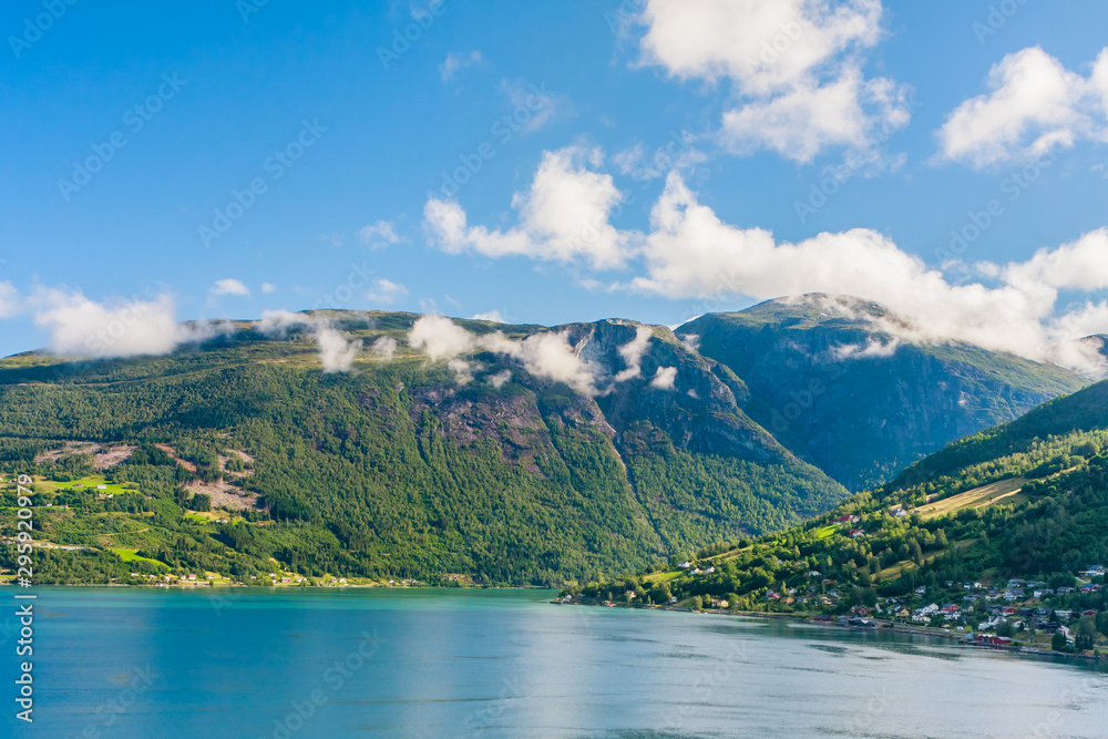 Fototapeta premium Olden, Norway, typical summer panorama of Norwegian village landscape, mountains and colorful traditional nordic houses