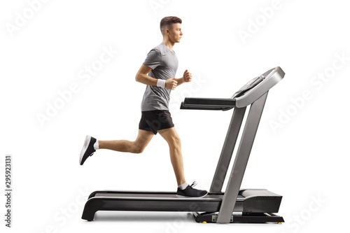 Young guy running on a professional treadmill