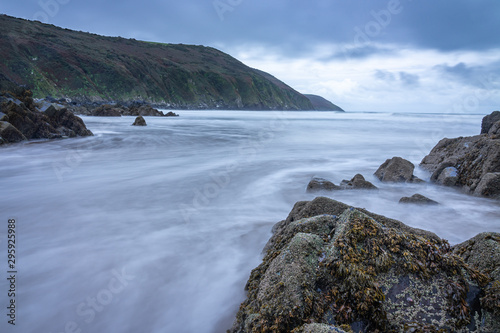 Ebbing tide exposing a rocky coast line in the morning light