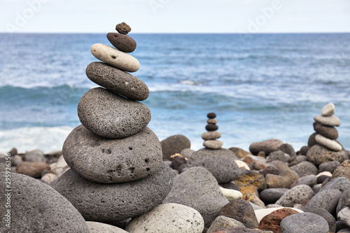 Murais de parede Stone stack on a beach, balance and harmony concept, selective focus