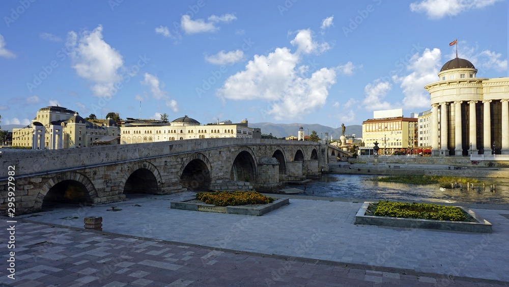 building in skopje at river during autumn