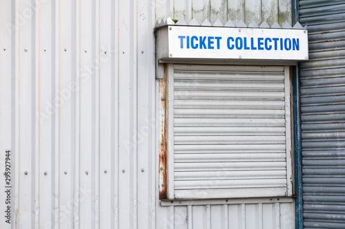 Ticket collection sign at box office counter by football sports event stadium