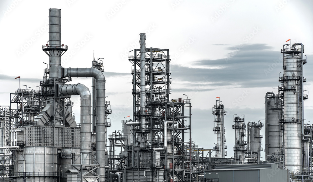 Large oil and gas refinery industrial area and beautiful lighting at Twilight. Large oil and gas refinery industrial area and beautiful lighting at Twilight.