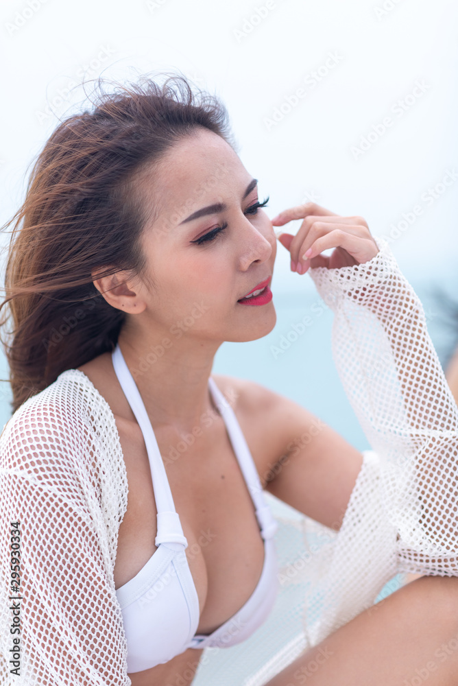 sexy Asian girl in white bikini, summer concept sexy Asian girl in white bikini, summer concept