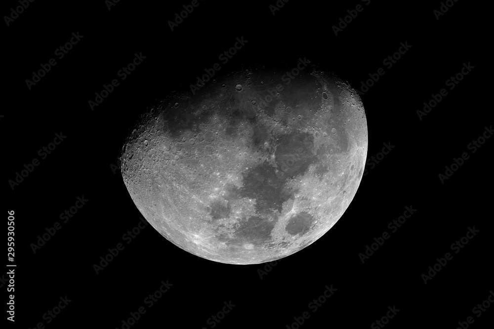 Waxing gibbous Moon phase, isolated in the black space, in this phase