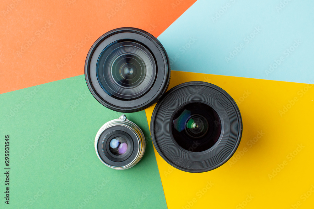 three photo lenses, on a colored background, a set of photo devices for the camera three photo lenses, on a colored background, a set of photo devices for the camera