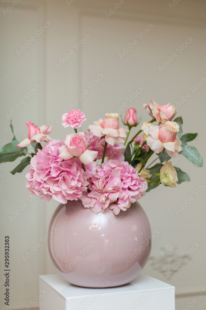 Wedding decorations. Holiday decoration vase with fresh flowers. Pink roses and carnations. Wedding decorations. Holiday decoration vase with fresh flowers. Pink roses and carnations.