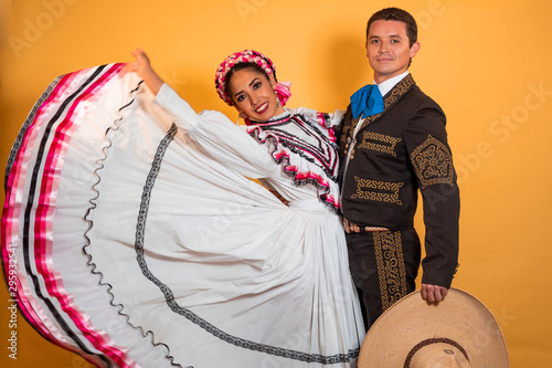 Charro and Adelita dancing young couple portrait in love folk culture  photo