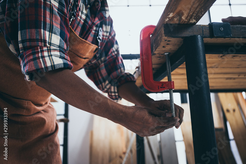 The carpenter is working in the studio, Handmade woodworking