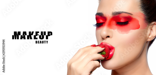 Serene beauty with bright makeup, red manicure and lipstick photo