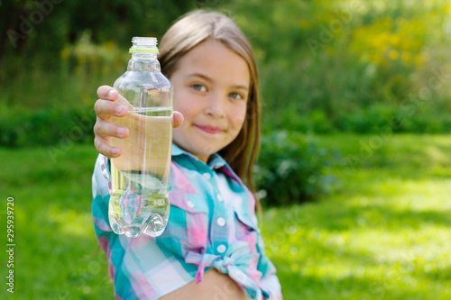 Child holds a water bottle