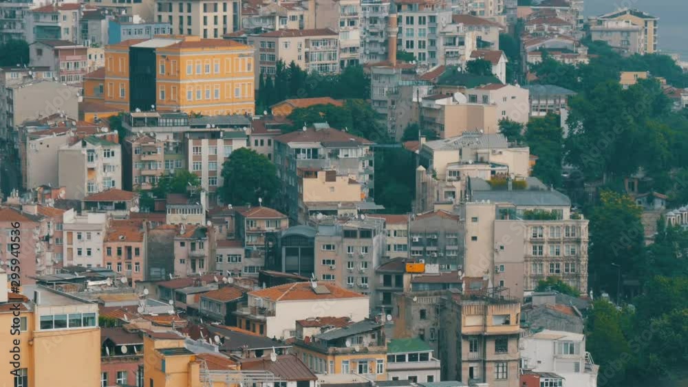 Crowded city Istanbul aerial view from the Galata tower. Panoramic view with many different house roofs Crowded city Istanbul aerial view from the Galata tower. Panoramic view with many different house roofs