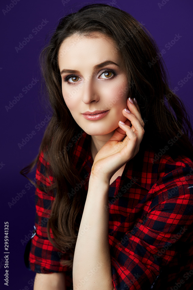 portrait of a lovely young woman in a studio portrait of a lovely young woman in a studio