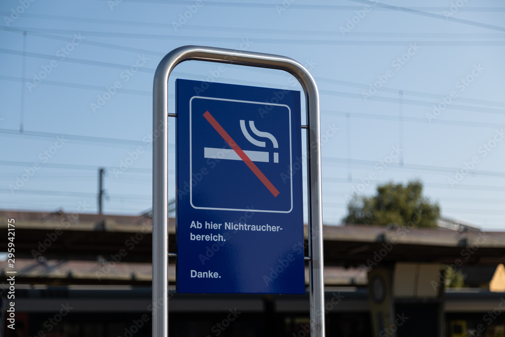 from here non-smoker area sign in blue with white writing from here non-smoker area sign in blue with white writing