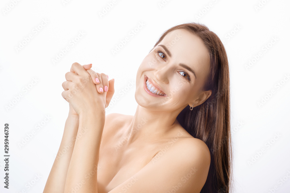 Smiling happy girl with white teeth and healthy skin clapping her hands Smiling happy girl with white teeth and healthy skin clapping her hands