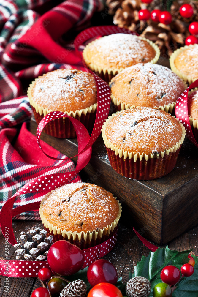 Christmas muffins covered powdered sugar on wooden table Christmas muffins covered powdered sugar on wooden table