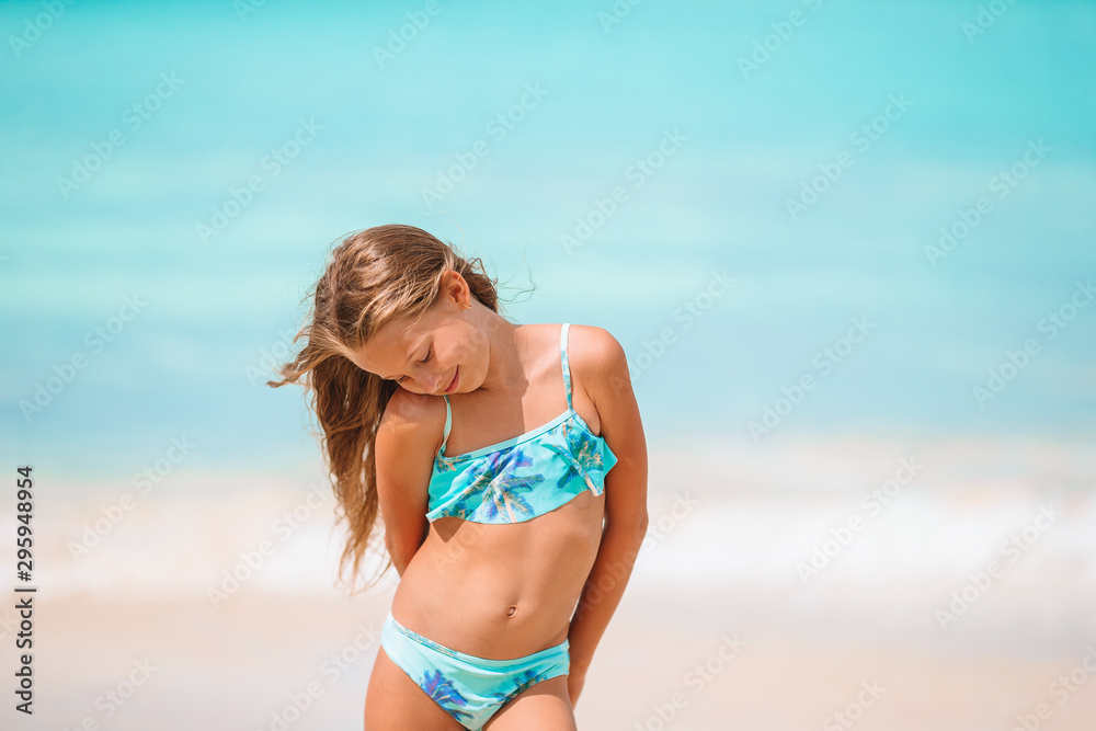Cute little girl at beach during summer vacation Cute little girl at beach during summer vacation