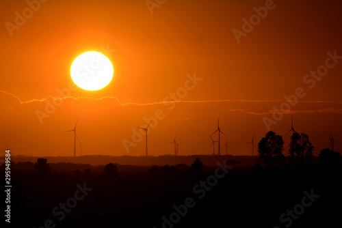 Silhouetes of windmills on a sunset, in Osório Wind Farm, Rio Grande do Sul, Brazil