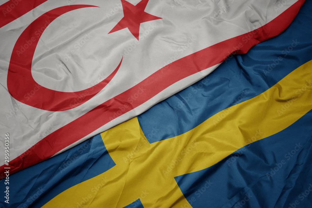 waving colorful flag of sweden and national flag of northern cyprus.