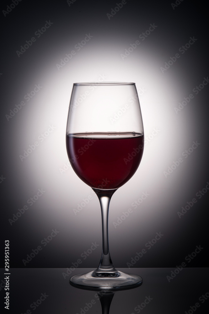 glass of wine on a gradient background glass of wine on a gradient background
