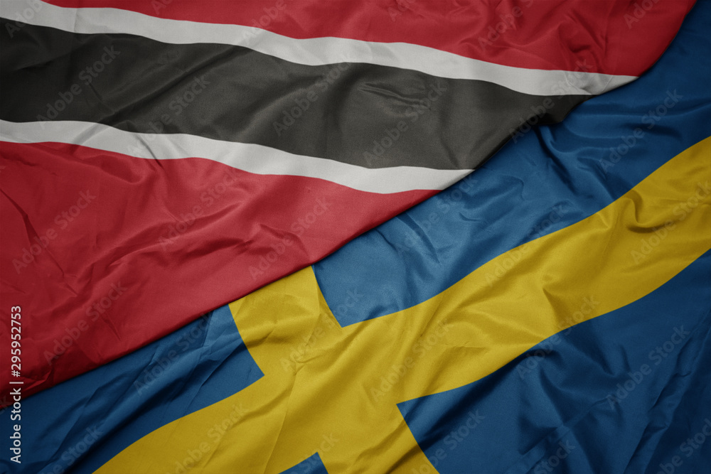 waving colorful flag of sweden and national flag of trinidad and tobago.
