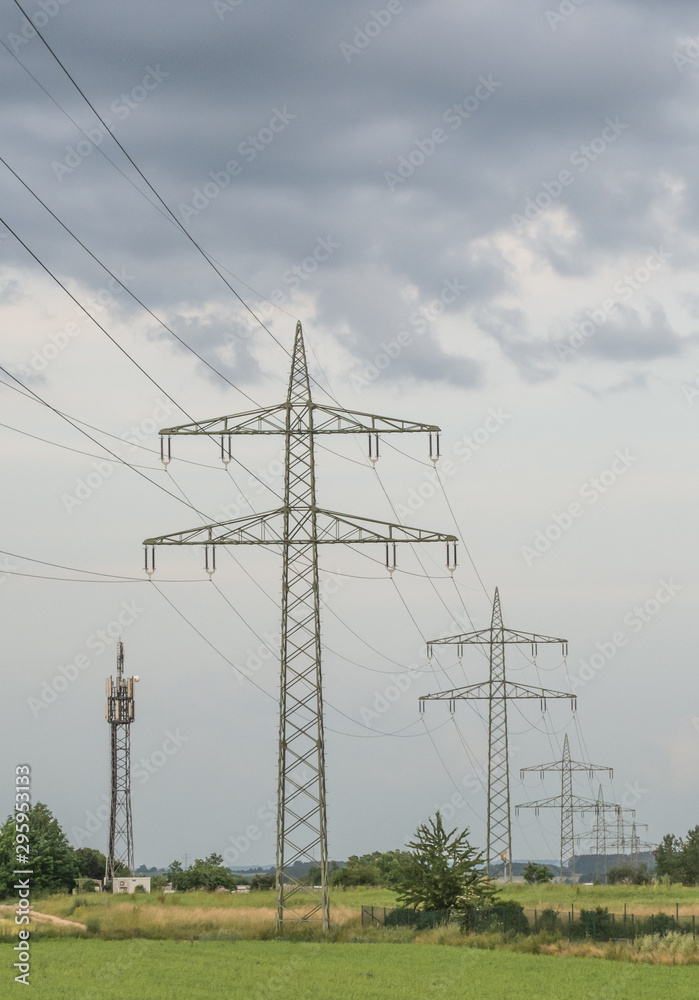 Electricity pylons and muddy skies