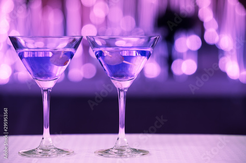 Colorful pair of martini drinks on bar 