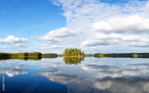 Wonderful autumn panorama of Haukkajarvi lake. Amazing morning view of National park Helvetinjarvi, Finland, Europe. Beauty of nature concept background. photo