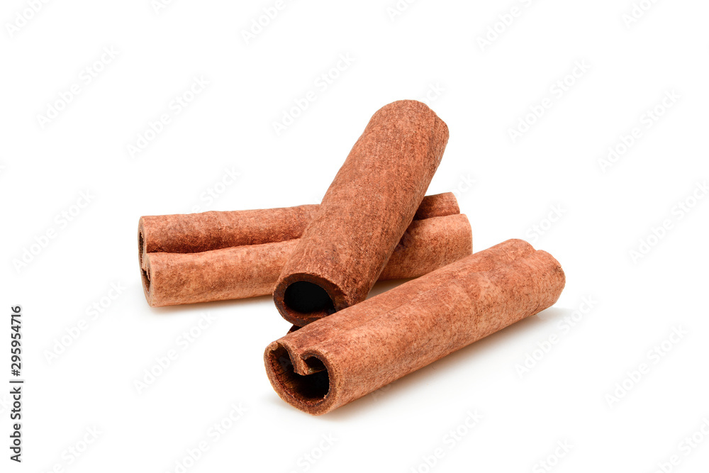 Cinnamon sticks for cooking and cosmetics. Close up macro isolated on white background with shadow. Full depth of field, high resolution. Cinnamon sticks for cooking and cosmetics. Close up macro isolated on white background with shadow. Full depth of field, high resolution.
