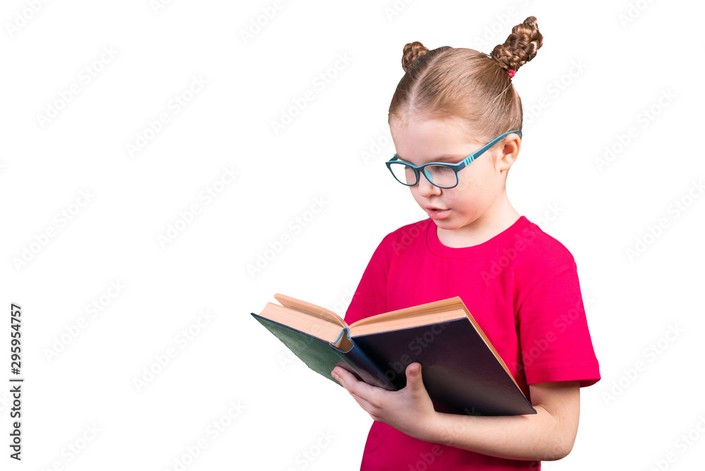 A girl with glasses is reading an old book. Isolated on a white background. A girl with glasses is reading an old book. Isolated on a white background.
