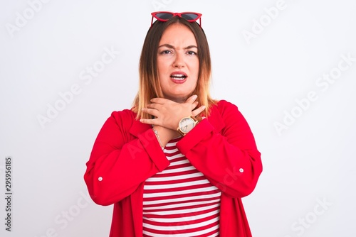 Young beautiful woman wearing striped t-shirt and jacket over isolated white background shouting and suffocate because painful strangle. Health problem. Asphyxiate and suicide concept.