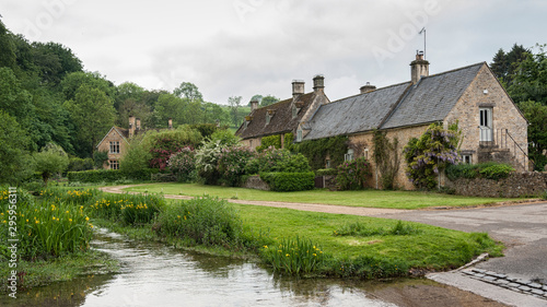 UPPER SLAUGHTER, COTSWOLDS, GLOUCESTERSHIRE, ENGLAND - MAY, 27 2018: Charming corners of the beautiful and pretty village of Upper Slaughter in the Cotswolds region - Gloucestershire, Cotswolds, UK photo