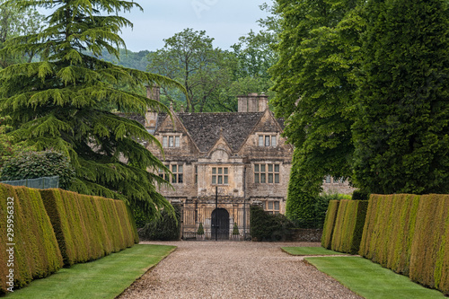 UPPER SLAUGHTER, ENGLAND - MAY, 27 2018: The Upper Slaughter Manor House is a picturesque Elizabethan manor set on 8 acres of landscaped gardens in Cotswolds village of Upper Slaughter