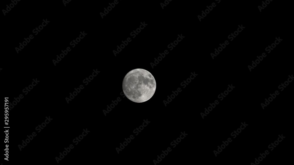 Transit of a full moon across the night sky Transit of a full moon across the night sky