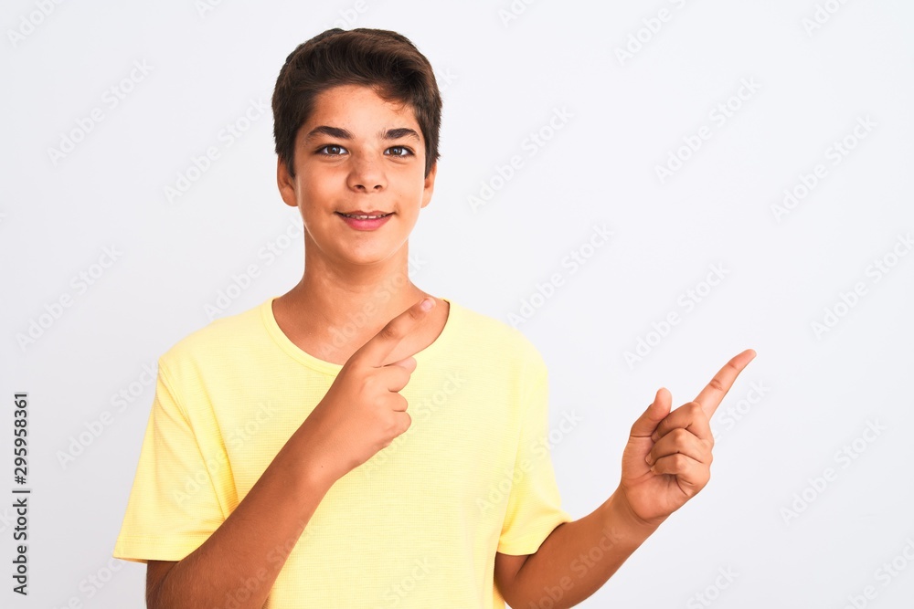 Handsome teenager boy standing over white isolated background smiling and looking at the camera pointing with two hands and fingers to the side. Handsome teenager boy standing over white isolated background smiling and looking at the camera pointing with two hands and fingers to the side.