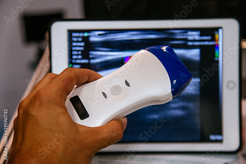Modern portable ultrasound machine in clinic laboratory of sonography diagnostics