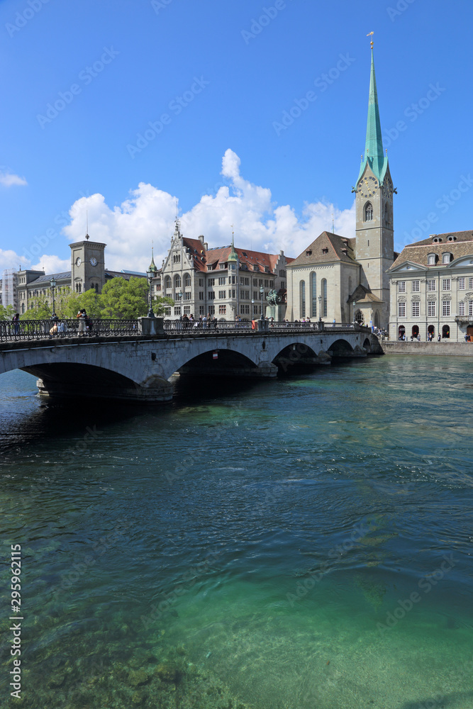 The Limmat river with the Fraumunster Church in the background, running through Zurich, Switzerland.
