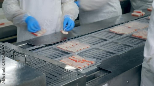 Crab sticks are getting packed by the factory staff